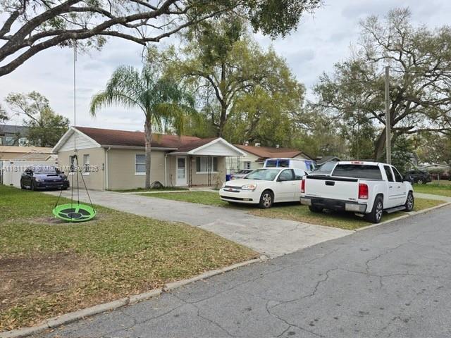 864 Lowell St E, Lakeland, FL 33805 - view of front of house with a front yard and driveway