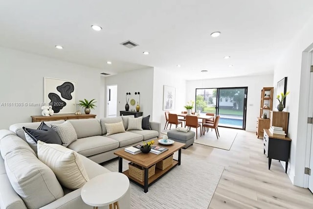 5700 SW 56th St, Davie, FL 33314 - living room featuring light wood-style floors and recessed lighting