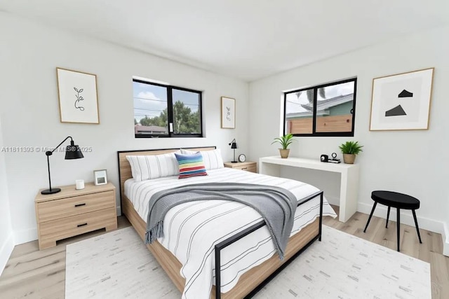 5700 SW 56th St, Davie, FL 33314 - bedroom with light wood-type flooring, multiple windows, and baseboards