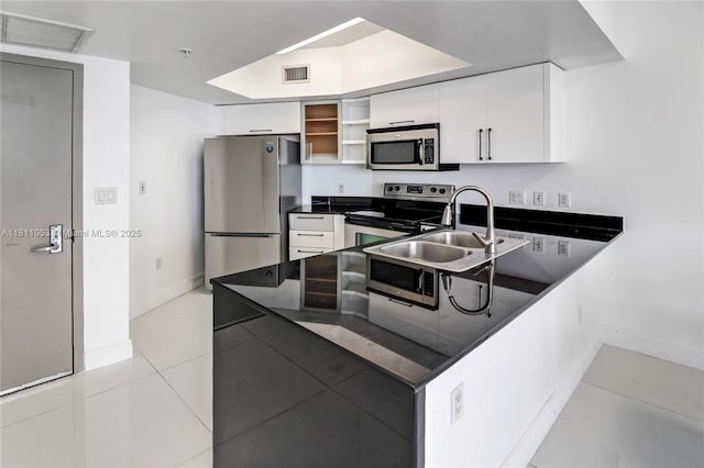 1750 N Bayshore Dr Unit 5214, Miami, FL 33132 - kitchen featuring stainless steel appliances, dark countertops, a sink, light tile patterned floors, and white cabinets