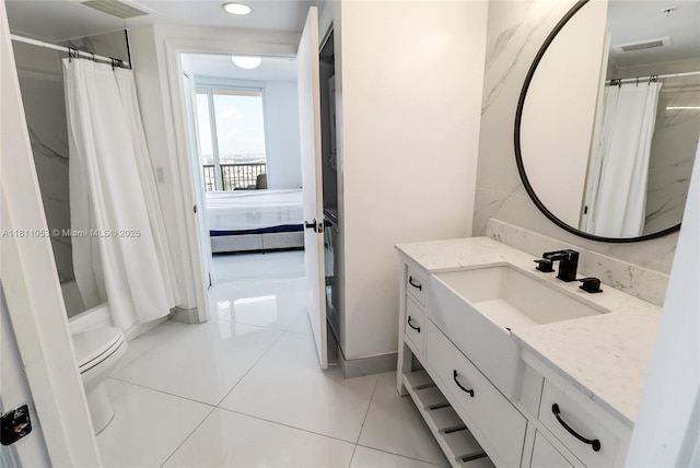 1750 N Bayshore Dr Unit 5214, Miami, FL 33132 - bathroom with vanity, toilet, ensuite bathroom, tile patterned flooring, and recessed lighting