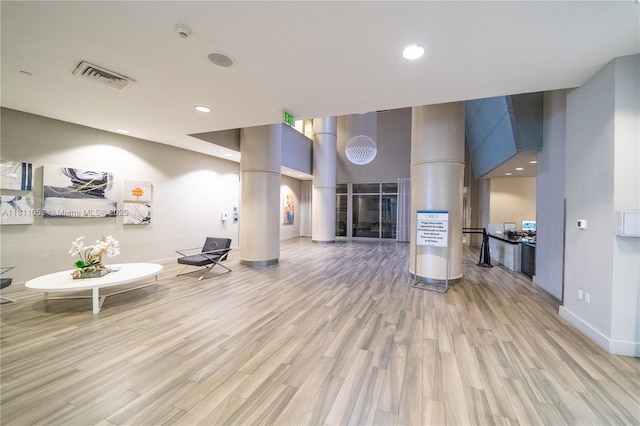 1750 N Bayshore Dr Unit 5214, Miami, FL 33132 - living area with decorative columns, light wood-style floors, baseboards, and recessed lighting