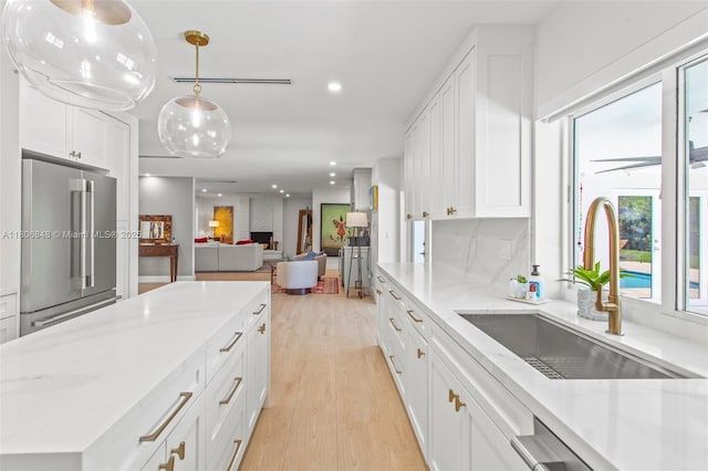 14270 SW 74th Ct, Palmetto Bay, FL 33158 - kitchen featuring stainless steel appliances, a sink, healthy amount of natural light, light wood-style flooring, and recessed lighting