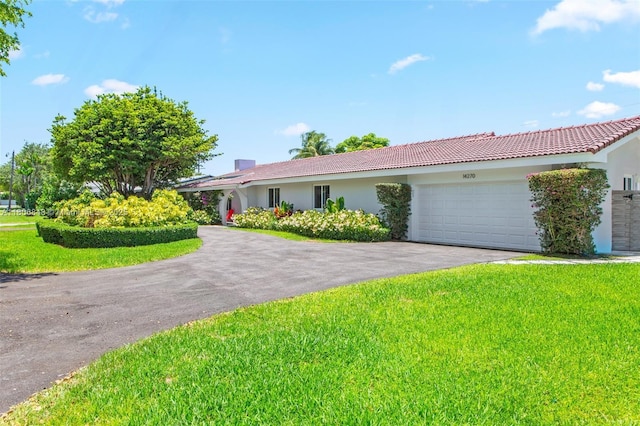 14270 SW 74th Ct, Palmetto Bay, FL 33158 - ranch-style house with an attached garage, stucco siding, driveway, and a front yard