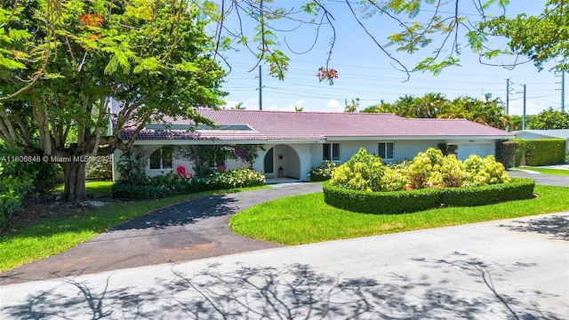 14270 SW 74th Ct, Palmetto Bay, FL 33158 - ranch-style home with curved driveway, a tiled roof, and stucco siding