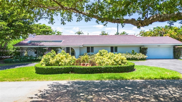 14270 SW 74th Ct, Palmetto Bay, FL 33158 - ranch-style house featuring stucco siding, a tiled roof, a garage, and asphalt driveway