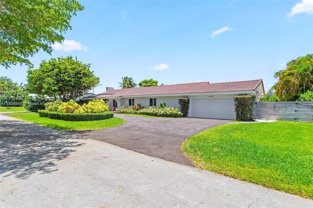 14270 SW 74th Ct, Palmetto Bay, FL 33158 - ranch-style home with asphalt driveway, an attached garage, a tile roof, and stucco siding