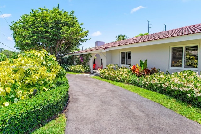 14270 SW 74th Ct, Palmetto Bay, FL 33158 - ranch-style home with stucco siding, a chimney, and a tile roof