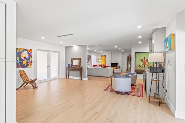 14270 SW 74th Ct, Palmetto Bay, FL 33158 - living room with french doors, light wood-style flooring, recessed lighting, baseboards, and a fireplace