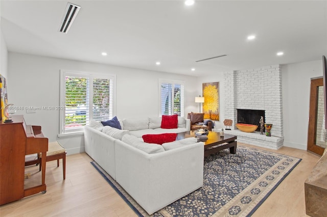14270 SW 74th Ct, Palmetto Bay, FL 33158 - living area with a brick fireplace, light wood finished floors, recessed lighting, and baseboards