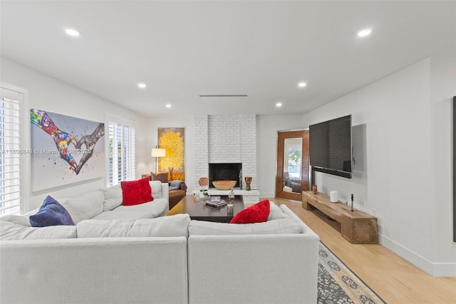 14270 SW 74th Ct, Palmetto Bay, FL 33158 - living room featuring light wood finished floors, recessed lighting, a brick fireplace, and baseboards