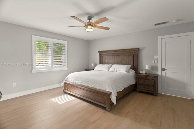 14270 SW 74th Ct, Palmetto Bay, FL 33158 - bedroom featuring baseboards, light wood-style flooring, and a ceiling fan