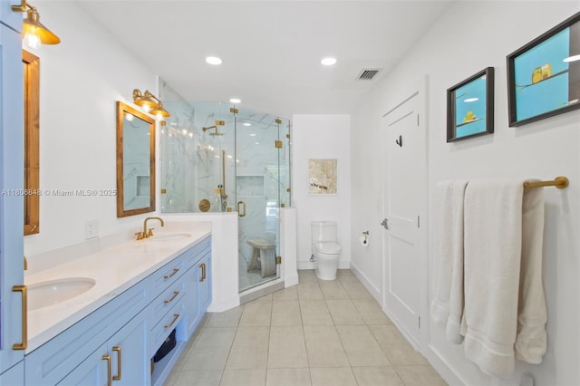 14270 SW 74th Ct, Palmetto Bay, FL 33158 - bathroom featuring toilet, double vanity, tile patterned flooring, a marble finish shower, and recessed lighting