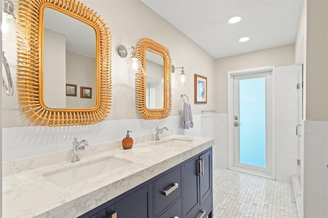14270 SW 74th Ct, Palmetto Bay, FL 33158 - full bathroom featuring tile walls, double vanity, wainscoting, a shower with shower door, and recessed lighting