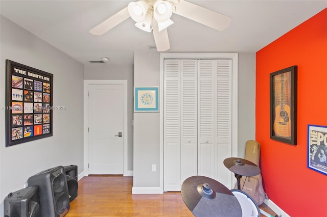 14270 SW 74th Ct, Palmetto Bay, FL 33158 - sitting room with a ceiling fan, wood finished floors, and baseboards