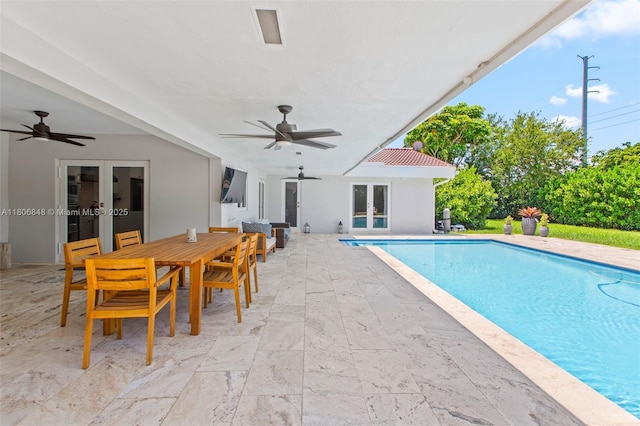 14270 SW 74th Ct, Palmetto Bay, FL 33158 - outdoor pool with french doors, a ceiling fan, a patio area, and outdoor dining area