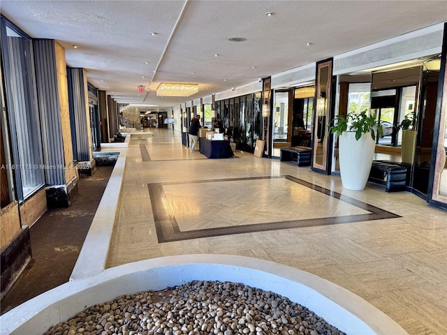 5555 Collins Ave Unit 6E, Miami Beach, FL 33140 - community lobby with a textured ceiling