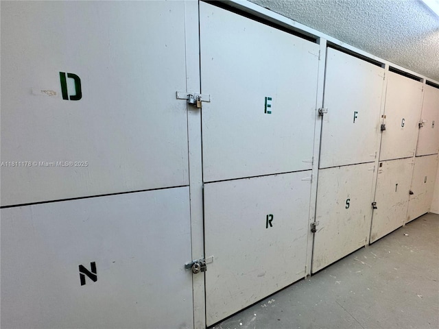 5555 Collins Ave Unit 6E, Miami Beach, FL 33140 - detailed view of concrete floors and a textured ceiling