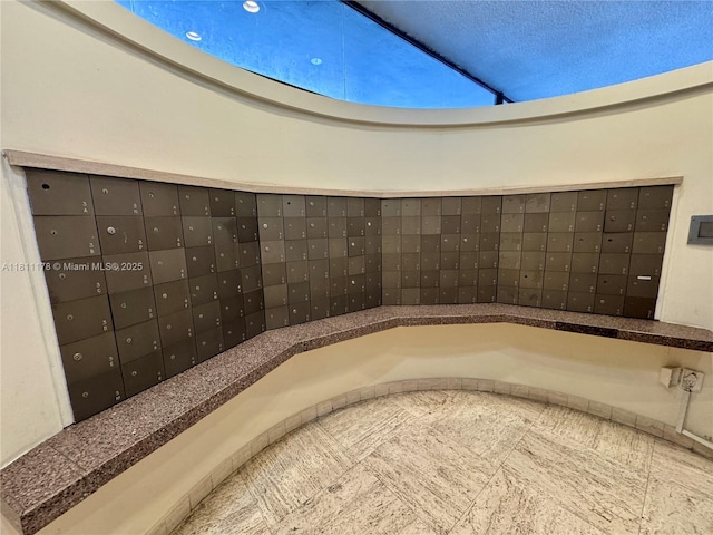5555 Collins Ave Unit 6E, Miami Beach, FL 33140 - detailed view of mail area and stucco siding