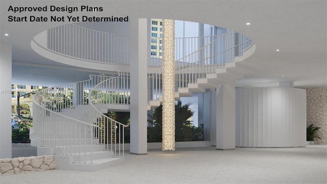5555 Collins Ave Unit 6E, Miami Beach, FL 33140 - community lobby featuring stairs, a high ceiling, recessed lighting, and wallpapered walls