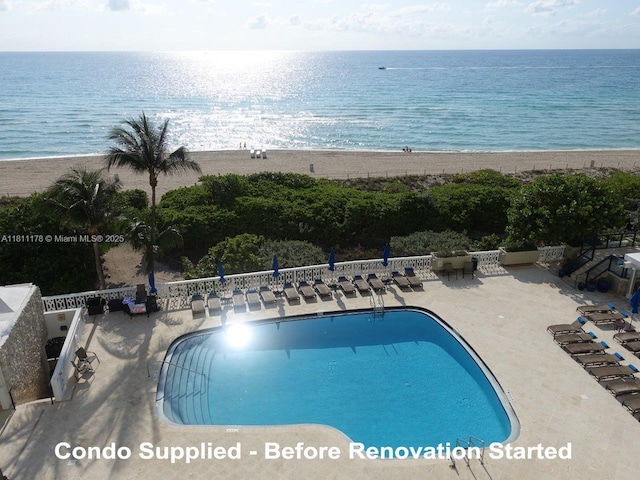 5555 Collins Ave Unit 6E, Miami Beach, FL 33140 - community pool with view of water and beach and a patio area