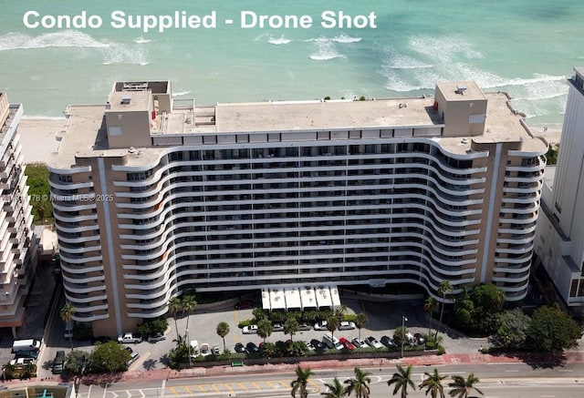 5555 Collins Ave Unit 6E, Miami Beach, FL 33140 - view of building exterior featuring view of water and beach