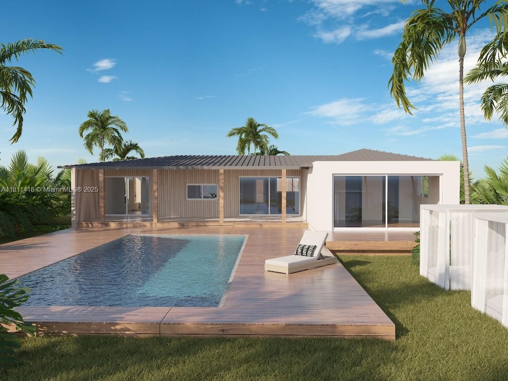 360 NW 87th St, El Portal, FL 33150 - rear view of property featuring a deck, an outdoor pool, a lawn, and metal roof