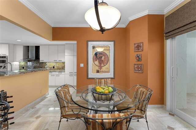 2213 Fisher Island Dr Unit 3103, Miami Beach, FL 33109 - dining area featuring ornamental molding and baseboards