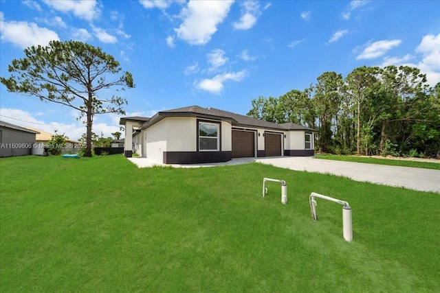 4800 Nelson Dr, Lehigh Acres, FL 33973 - single story home featuring a garage, a front lawn, driveway, and stucco siding