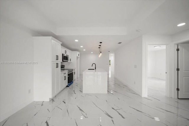 4800 Nelson Dr, Lehigh Acres, FL 33973 - kitchen featuring stainless steel appliances, baseboards, recessed lighting, a sink, and white cabinets