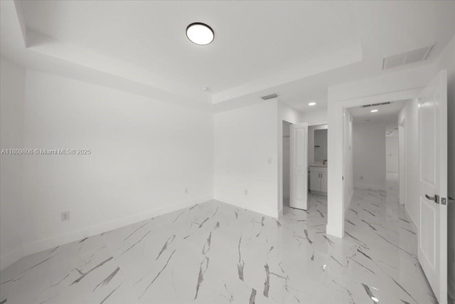4800 Nelson Dr, Lehigh Acres, FL 33973 - empty room featuring baseboards, a tray ceiling, and recessed lighting