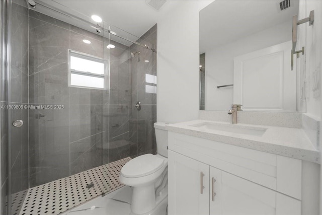 4800 Nelson Dr, Lehigh Acres, FL 33973 - full bathroom featuring vanity, toilet, a shower stall, and marble finish flooring