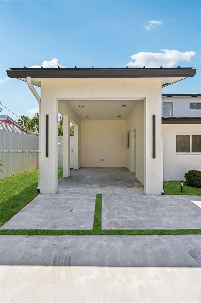 2001 SW 23rd Ave, Fort Lauderdale, FL 33312 - view of parking with concrete driveway and a carport