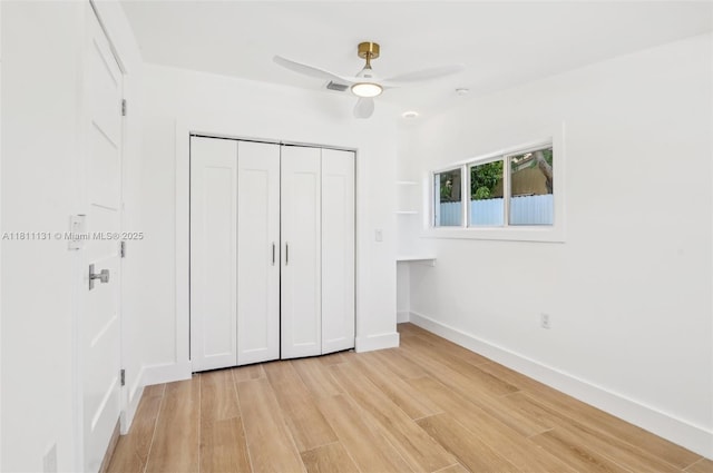 2001 SW 23rd Ave, Fort Lauderdale, FL 33312 - unfurnished bedroom featuring light wood-style floors, a closet, baseboards, and ceiling fan