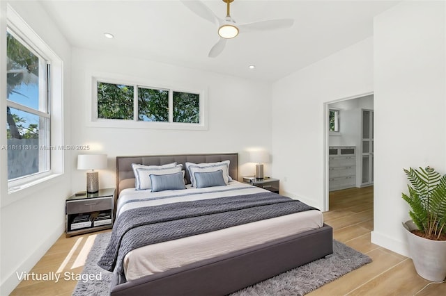 2001 SW 23rd Ave, Fort Lauderdale, FL 33312 - bedroom with light wood-style flooring, a ceiling fan, and baseboards