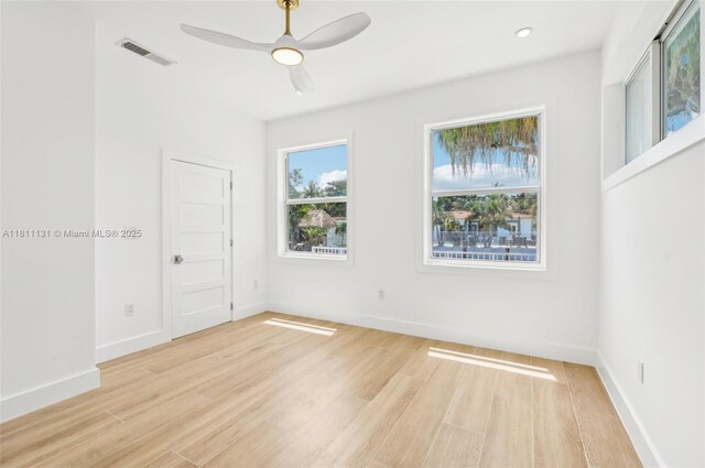 2001 SW 23rd Ave, Fort Lauderdale, FL 33312 - empty room featuring light wood-type flooring, a ceiling fan, and baseboards