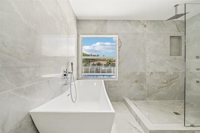 2001 SW 23rd Ave, Fort Lauderdale, FL 33312 - full bathroom featuring tile walls, a freestanding tub, and a marble finish shower