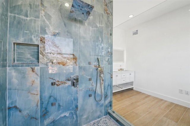 2001 SW 23rd Ave, Fort Lauderdale, FL 33312 - bathroom featuring a marble finish shower, vanity, wood finished floors, baseboards, and recessed lighting