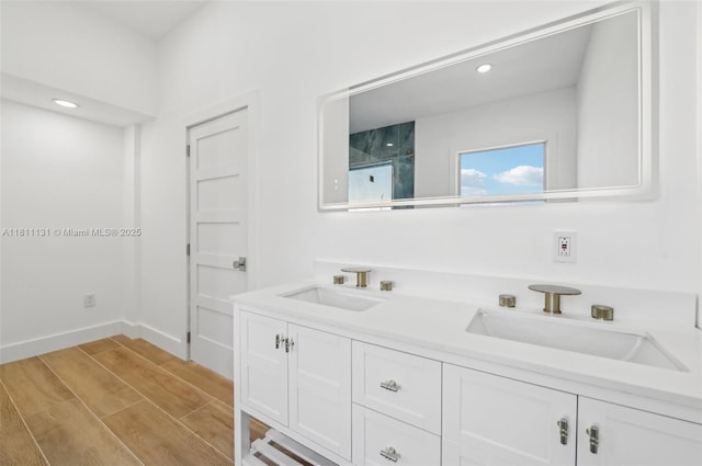 2001 SW 23rd Ave, Fort Lauderdale, FL 33312 - full bathroom featuring double vanity, wood finished floors, recessed lighting, and baseboards