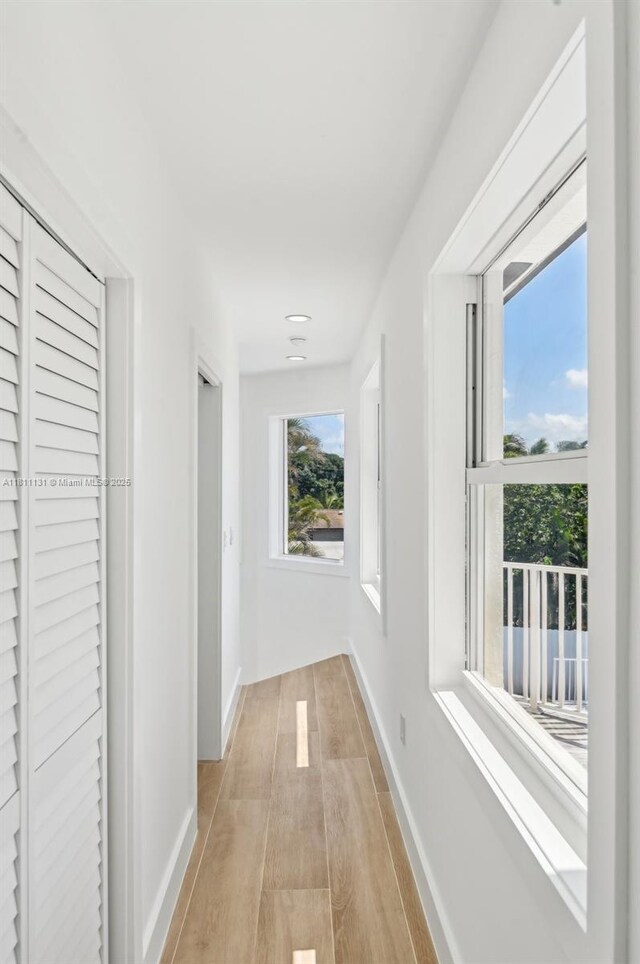 2001 SW 23rd Ave, Fort Lauderdale, FL 33312 - hall with baseboards and light wood-type flooring