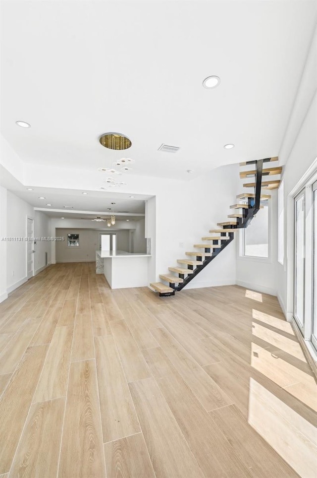 2001 SW 23rd Ave, Fort Lauderdale, FL 33312 - unfurnished living room with stairway, light wood-style floors, recessed lighting, and baseboards
