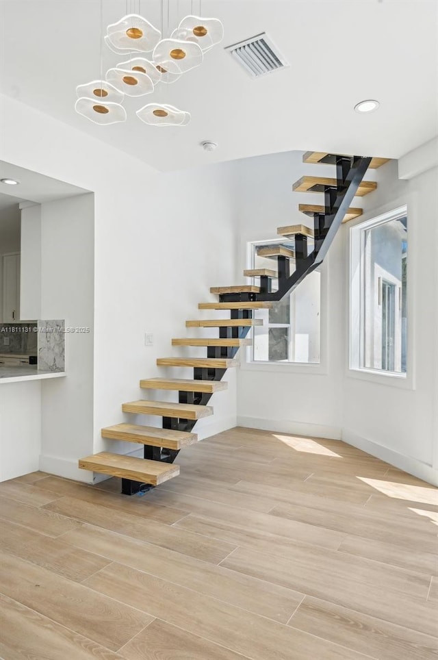 2001 SW 23rd Ave, Fort Lauderdale, FL 33312 - staircase featuring wood finished floors, recessed lighting, baseboards, and a chandelier