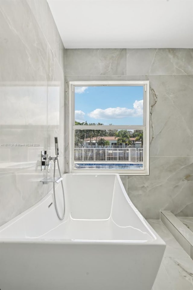 2001 SW 23rd Ave, Fort Lauderdale, FL 33312 - bathroom with a soaking tub and plenty of natural light