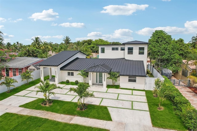 2001 SW 23rd Ave, Fort Lauderdale, FL 33312 - view of front of property with a standing seam roof, stucco siding, driveway, and metal roof