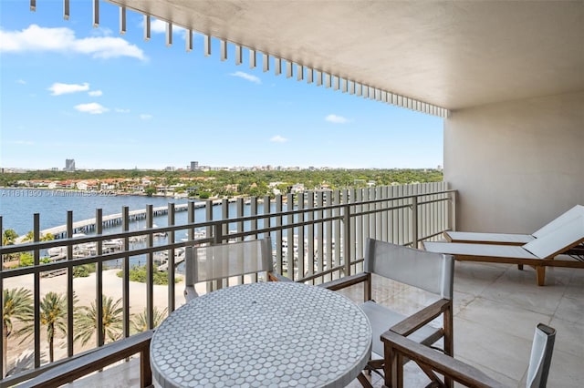 2 Grove Isle Dr Unit B1108, Miami, FL 33133 - balcony featuring a water view and outdoor dining space