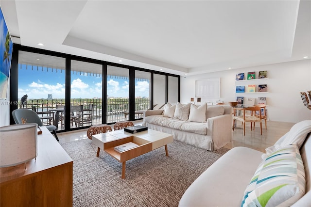 2 Grove Isle Dr Unit B1108, Miami, FL 33133 - living area featuring a wall of windows, a tray ceiling, and recessed lighting