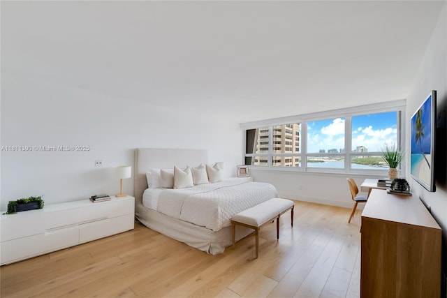 2 Grove Isle Dr Unit B1108, Miami, FL 33133 - bedroom featuring light wood finished floors and baseboards