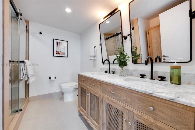 2 Grove Isle Dr Unit B1108, Miami, FL 33133 - bathroom featuring double vanity, toilet, a shower stall, and baseboards