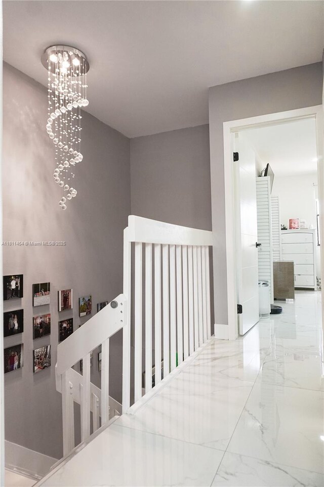 721 NW 105th Ter Unit 721, Pembroke Pines, FL 33026 - corridor featuring marble finish flooring and a chandelier