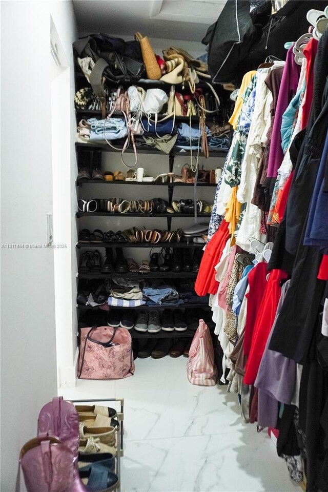 721 NW 105th Ter Unit 721, Pembroke Pines, FL 33026 - walk in closet featuring marble look tiles